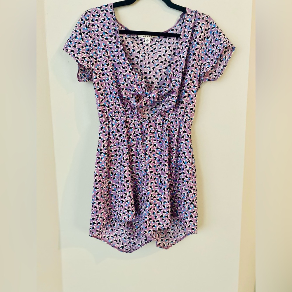 Francesca’s-Miami. Lilac short sleeve romper with bow key hole. Size Small (S)
